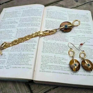 Vintage gold tone bracelet and earring set stone similar to tigers eye with blue